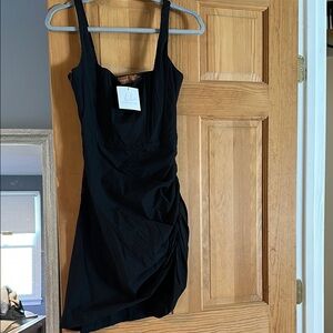 Bobbles and Lace black mini dress. Never worn.